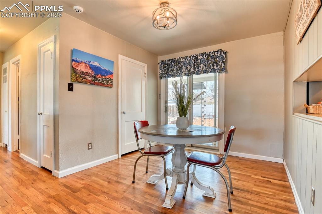 2409 Wahsatch Avenue Colorado Springs, CO 80907 - Photo 5 of 47 a view of a dining room with furniture window and wooden floor