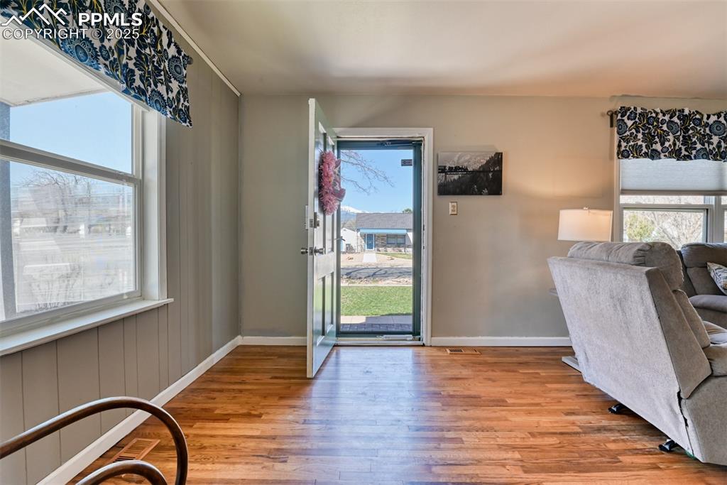 2409 Wahsatch Avenue Colorado Springs, CO 80907 - Photo 8 of 47 a view of a livingroom with wooden floor and furniture