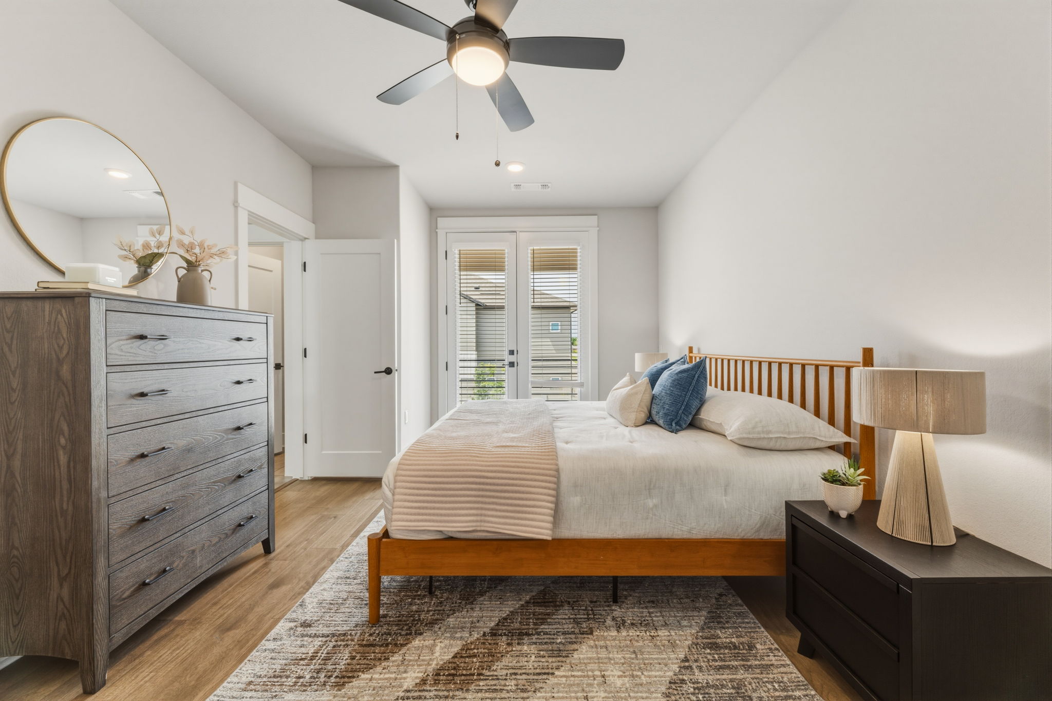2929 Moreno Street Austin, TX 78723 - Photo 33 of 40 Spacious room featuring wood-finish flooring, a contemporary ceiling fan, and white walls