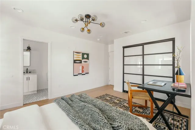 a bed room with a bed and a window