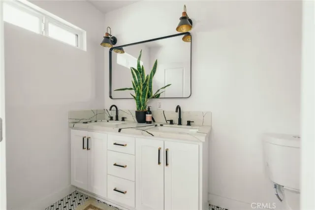 a bed room with a bed and a window