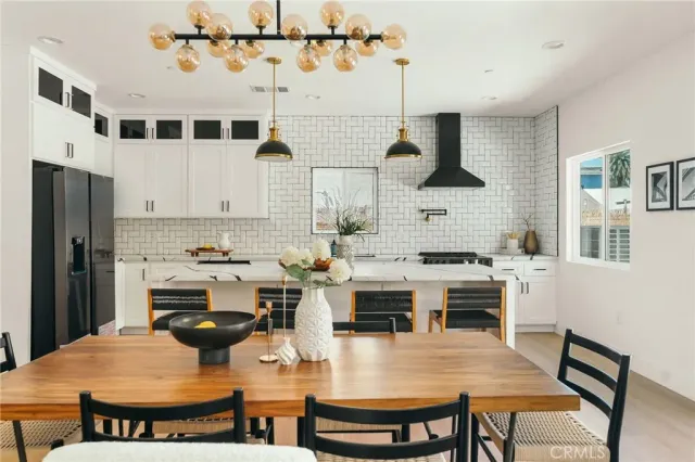 a bedroom with a bed a table and a painting