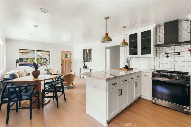 a view of a hallway with a furniture and a living room