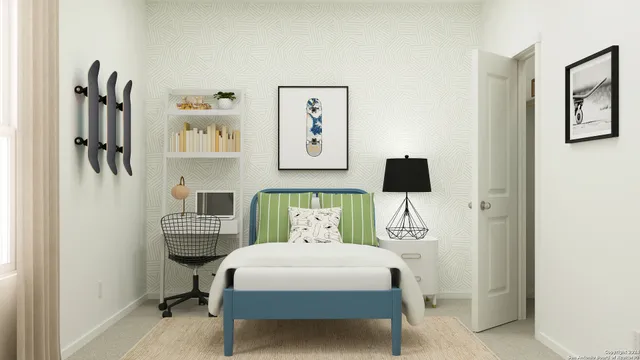 a bedroom with a bed a desk and chair