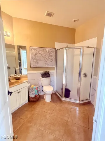 a spacious bathroom with a granite countertop sink and a mirror