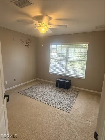 a view of an empty room with a window