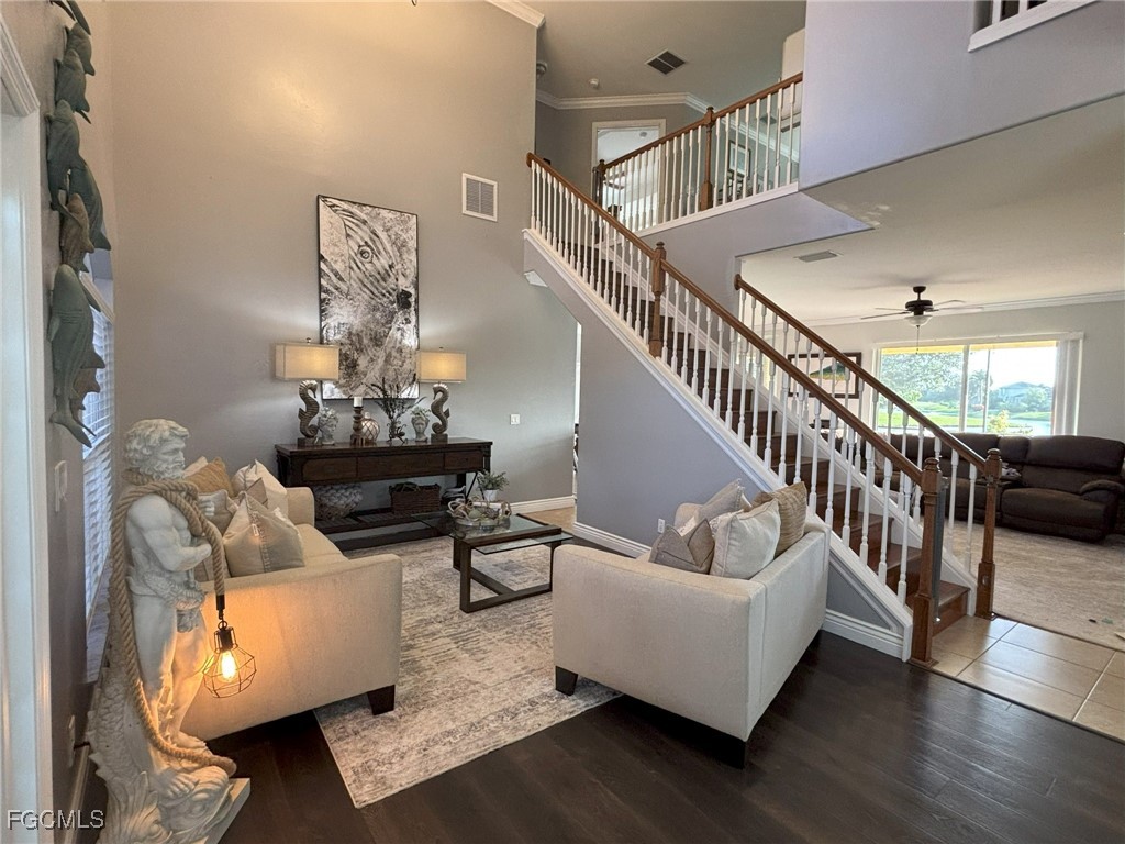 4577 Fairloop Run Lehigh Acres, FL 33973 - Photo 20 of 35 a living room with furniture and wooden floor