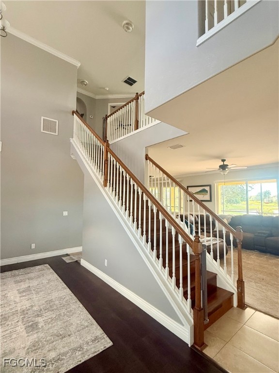 4577 Fairloop Run Lehigh Acres, FL 33973 - Photo 21 of 35 a view of staircase with lots of frames on wall and a window