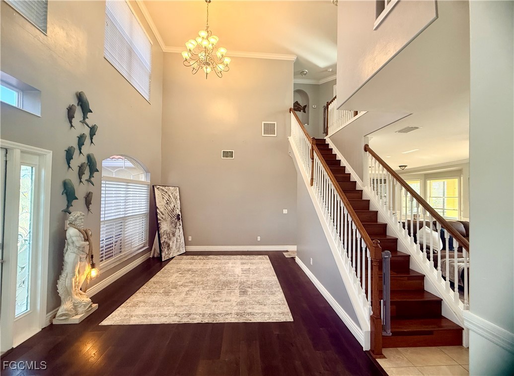 4577 Fairloop Run Lehigh Acres, FL 33973 - Photo 22 of 35 a view of an entryway with wooden floor