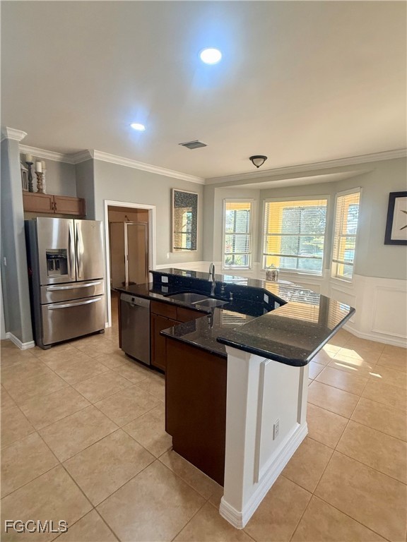 4577 Fairloop Run Lehigh Acres, FL 33973 - Photo 5 of 35 a kitchen with stainless steel appliances granite countertop a sink and a refrigerator