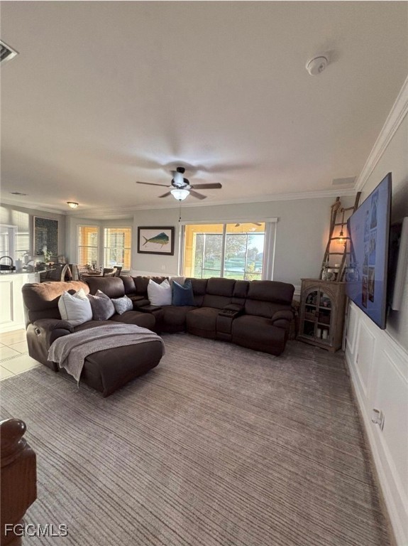 4577 Fairloop Run Lehigh Acres, FL 33973 - Photo 6 of 35 a living room with furniture a flat screen tv and a large window