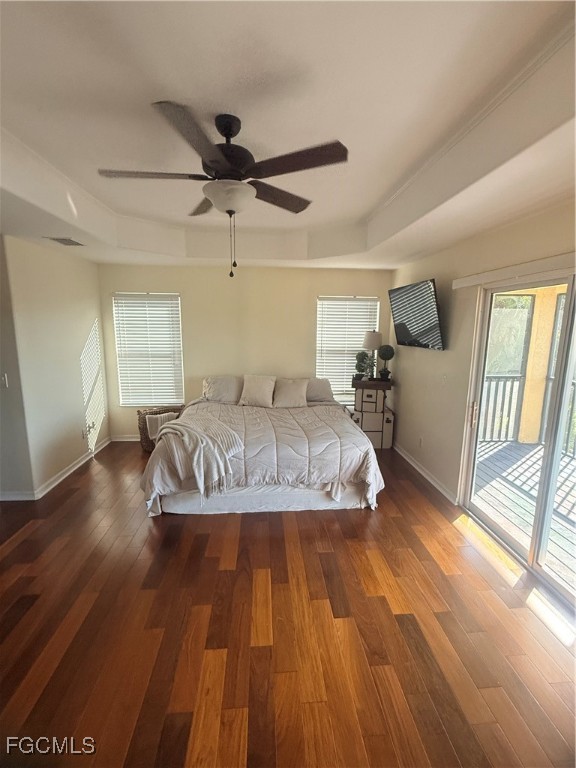 4577 Fairloop Run Lehigh Acres, FL 33973 - Photo 7 of 35 a bedroom with a bed and wooden floor