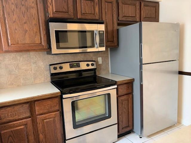 1141 12th Street McKees Rocks, PA 15136 - Photo 3 of 25 a kitchen with granite countertop cabinets stainless steel appliances and wooden cabinets