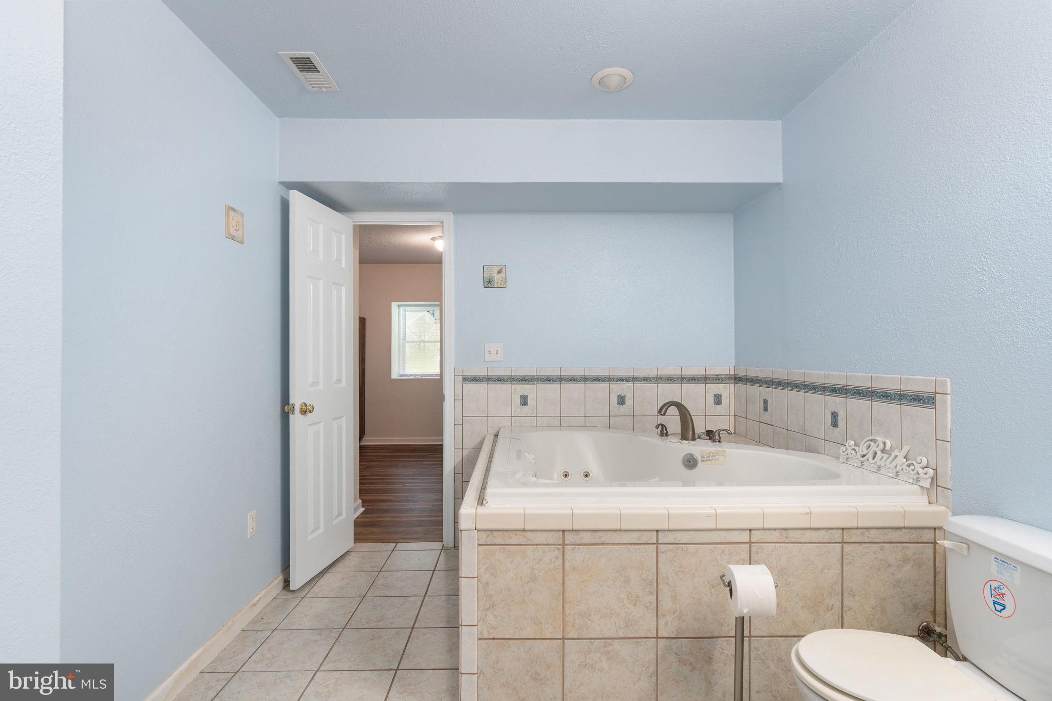 8009 Burrell Road Fredericksburg, VA 22407 - Photo 33 of 66 Serene blue bathroom retreat.