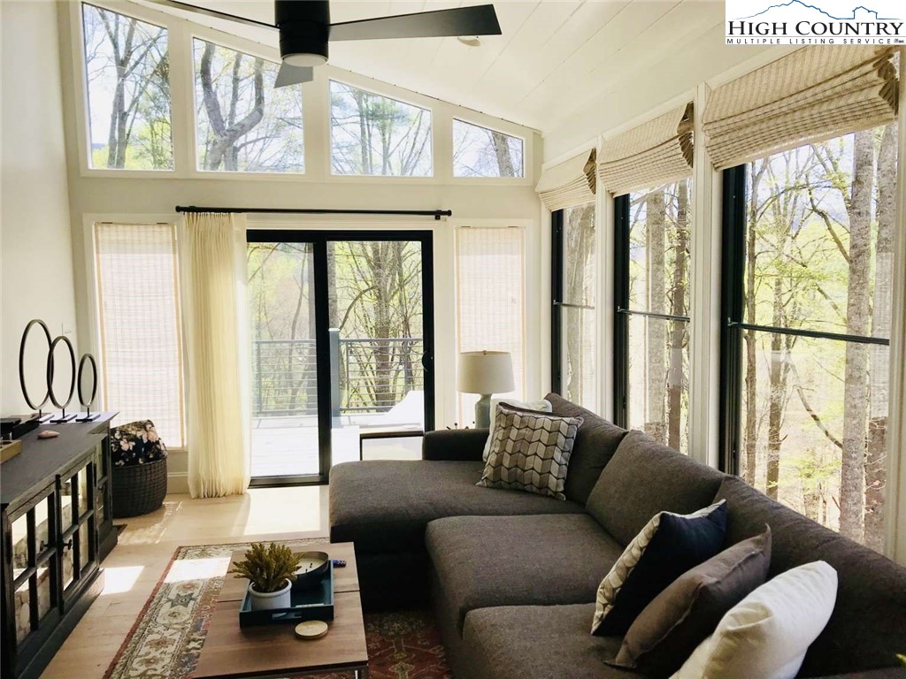 509 Crystal Mountain Road Boone, NC 28607 - Photo 14 of 24 a living room with furniture and a large window