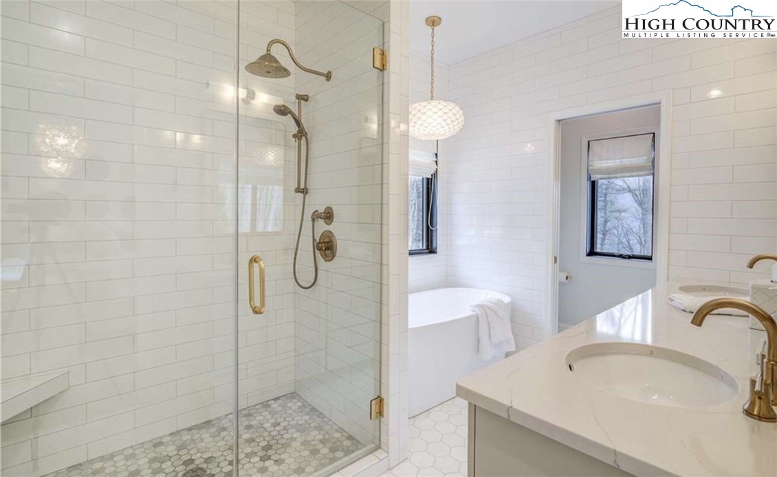 509 Crystal Mountain Road Boone, NC 28607 - Photo 17 of 24 a bathroom with a sink a toilet and shower