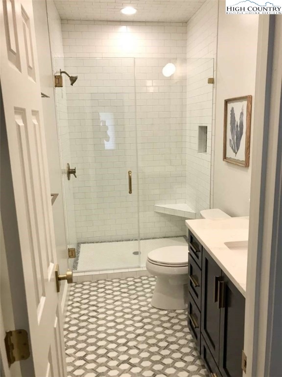 509 Crystal Mountain Road Boone, NC 28607 - Photo 20 of 24 a bathroom with a sink a toilet and shower