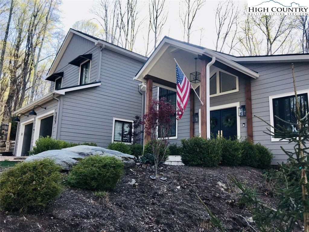 509 Crystal Mountain Road Boone, NC 28607 - Photo 2 of 24 a front view of a house with garden