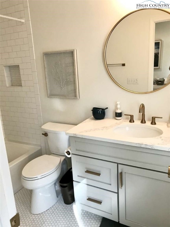 509 Crystal Mountain Road Boone, NC 28607 - Photo 22 of 24 a bathroom with a toilet a sink and mirror