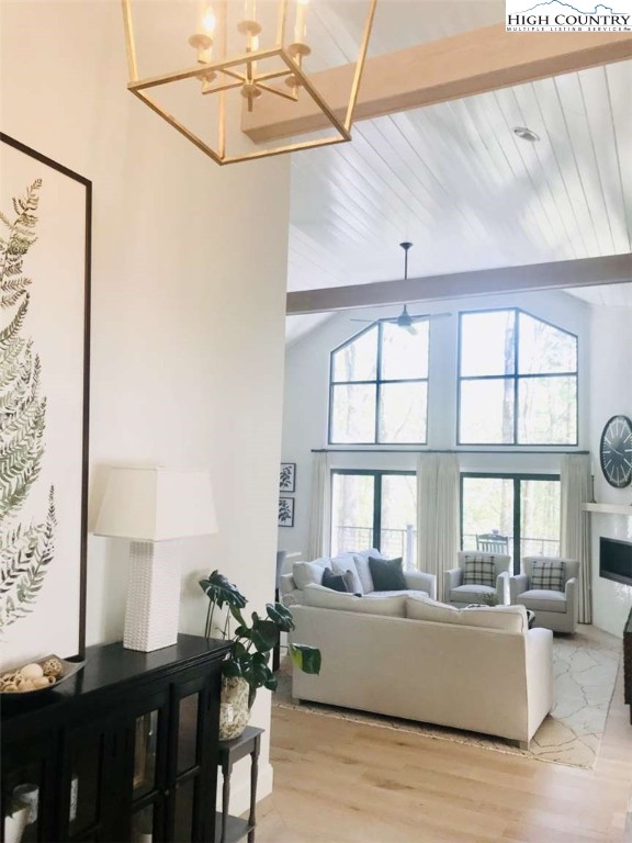 509 Crystal Mountain Road Boone, NC 28607 - Photo 4 of 24 a living room with a large window wooden floor and furniture