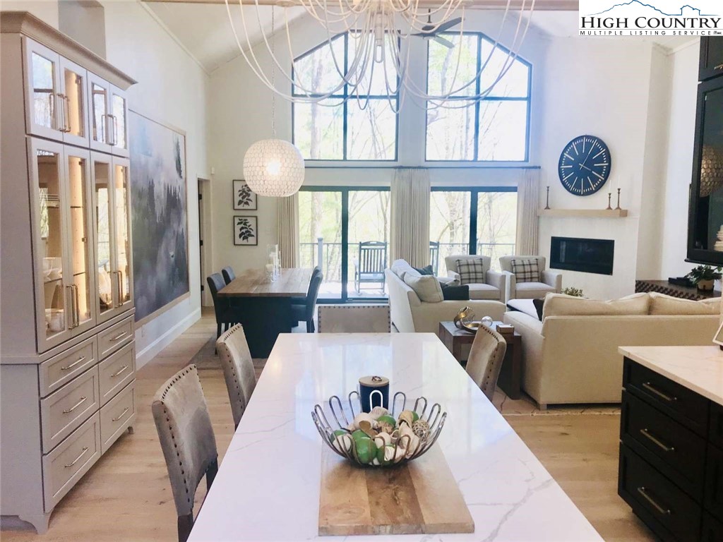 509 Crystal Mountain Road Boone, NC 28607 - Photo 10 of 24 a living room with fireplace furniture and a large window