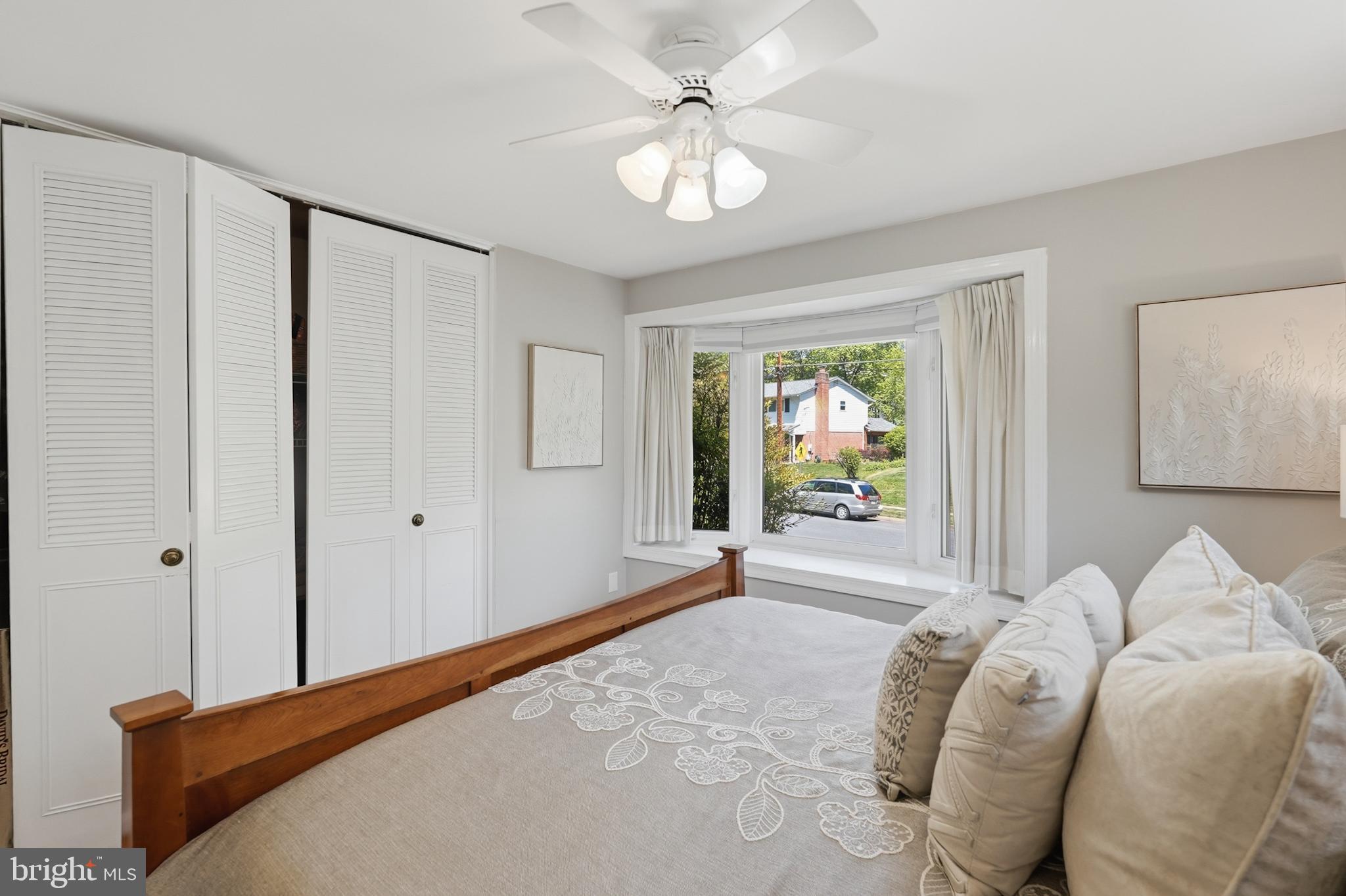 7006 Barnack Drive Springfield, VA 22152 - Photo 24 of 56 a bedroom with a bed and a chandelier