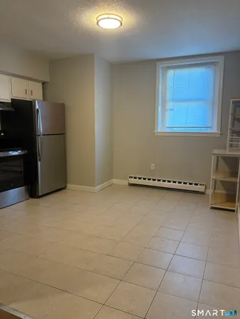 a kitchen with granite countertop a cabinets and steel stainless steel appliances