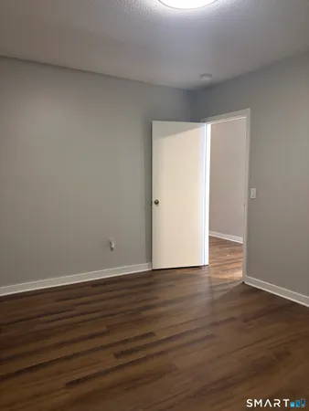 an empty room with a fireplace