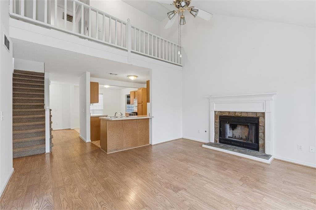 1032 Morgan Road Canton, GA 30115 - Photo 13 of 35 a view of kitchen and microwave with wooden floor