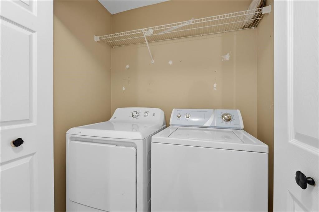 1032 Morgan Road Canton, GA 30115 - Photo 20 of 35 a utility room with dryer and washer