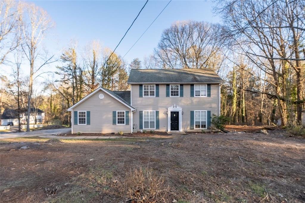 1032 Morgan Road Canton, GA 30115 - Photo 2 of 35 a front view of a house with a yard