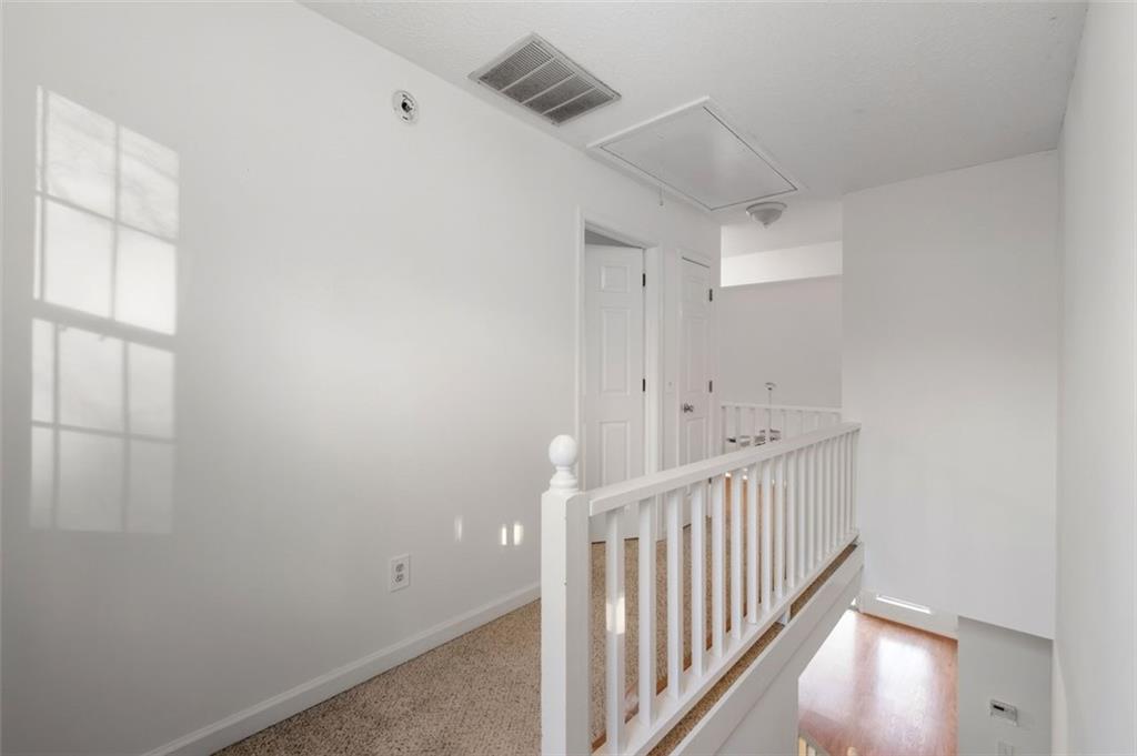 1032 Morgan Road Canton, GA 30115 - Photo 22 of 35 a view of a hallway with window
