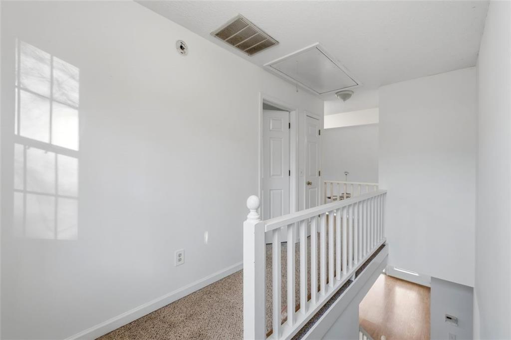 1032 Morgan Road Canton, GA 30115 - Photo 23 of 35 a view of hallway with window and wooden floor