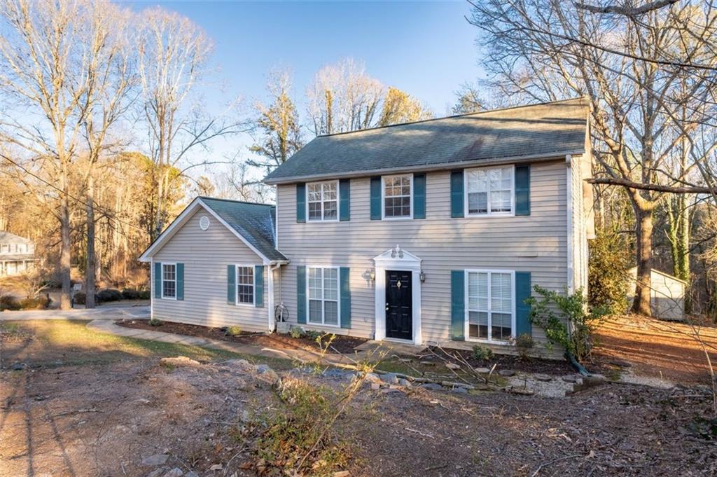 1032 Morgan Road Canton, GA 30115 - Photo 3 of 35 a view of a yard in front of a house