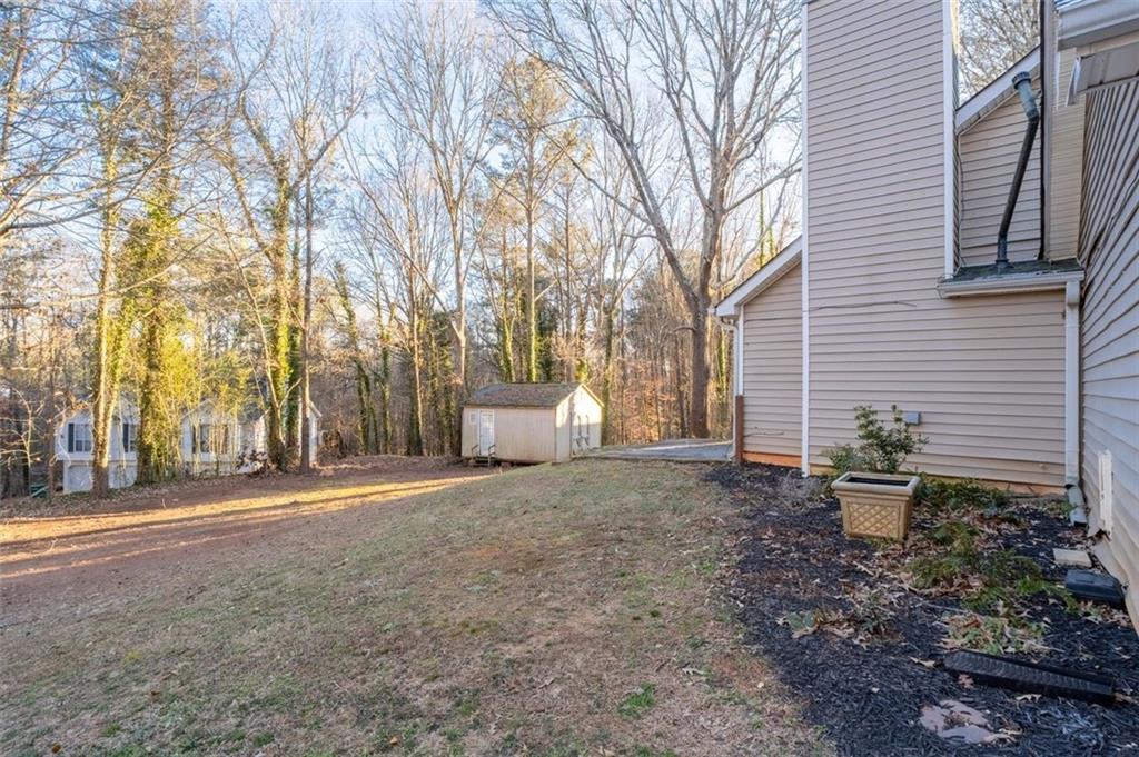 1032 Morgan Road Canton, GA 30115 - Photo 31 of 35 a view of a backyard with plants and trees