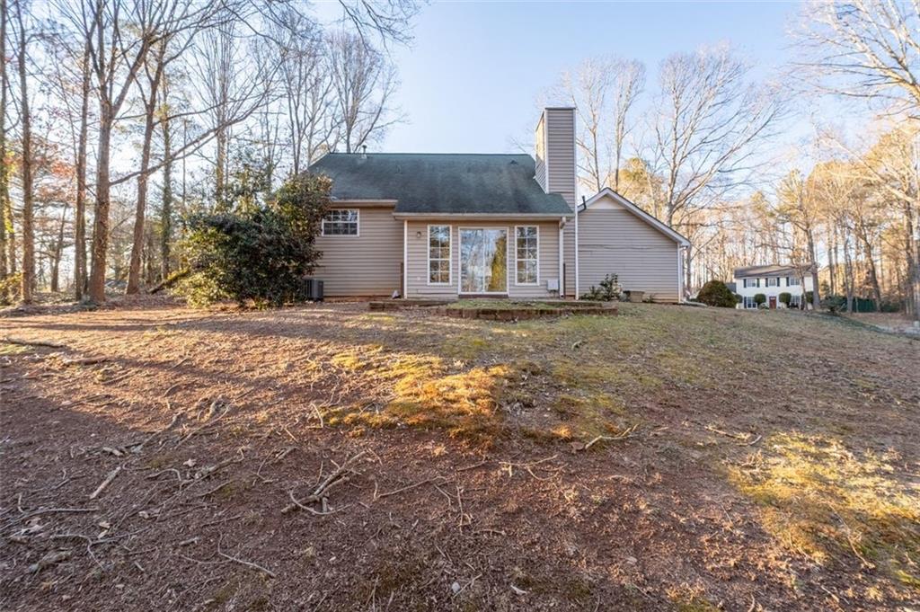 1032 Morgan Road Canton, GA 30115 - Photo 33 of 35 a view of a house with a yard covered in snow