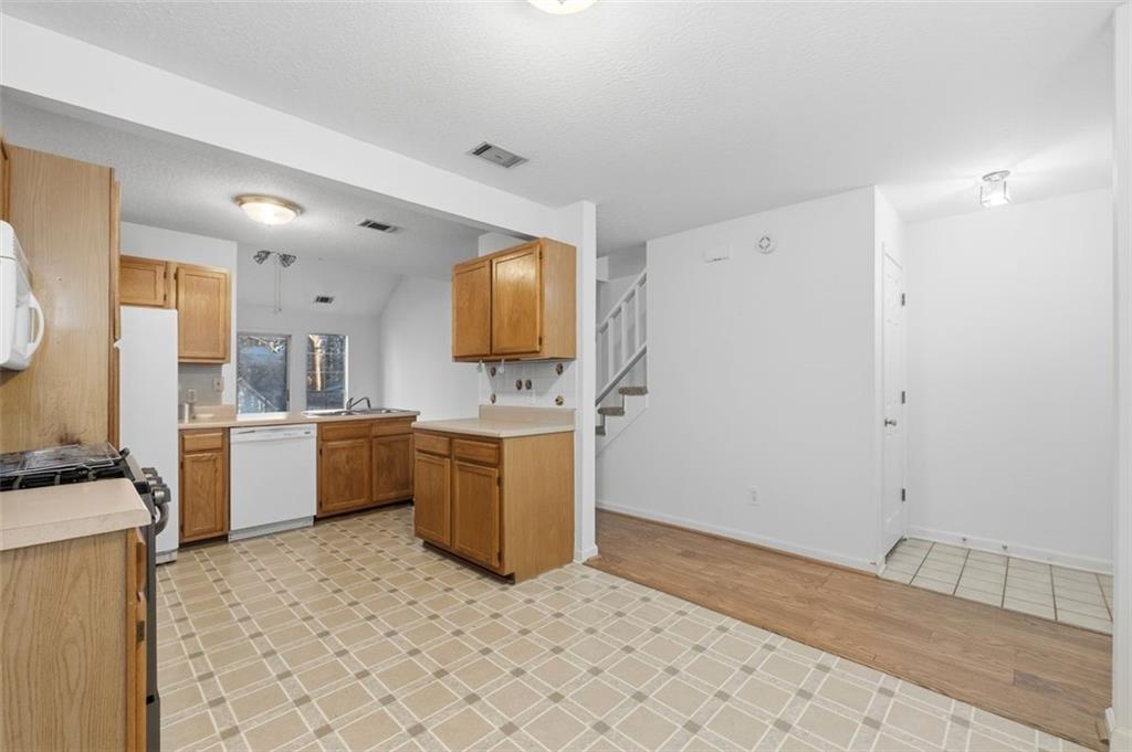 1032 Morgan Road Canton, GA 30115 - Photo 8 of 35 a kitchen with a sink cabinets and window