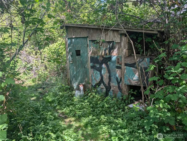 a backyard of a house with lots of green space