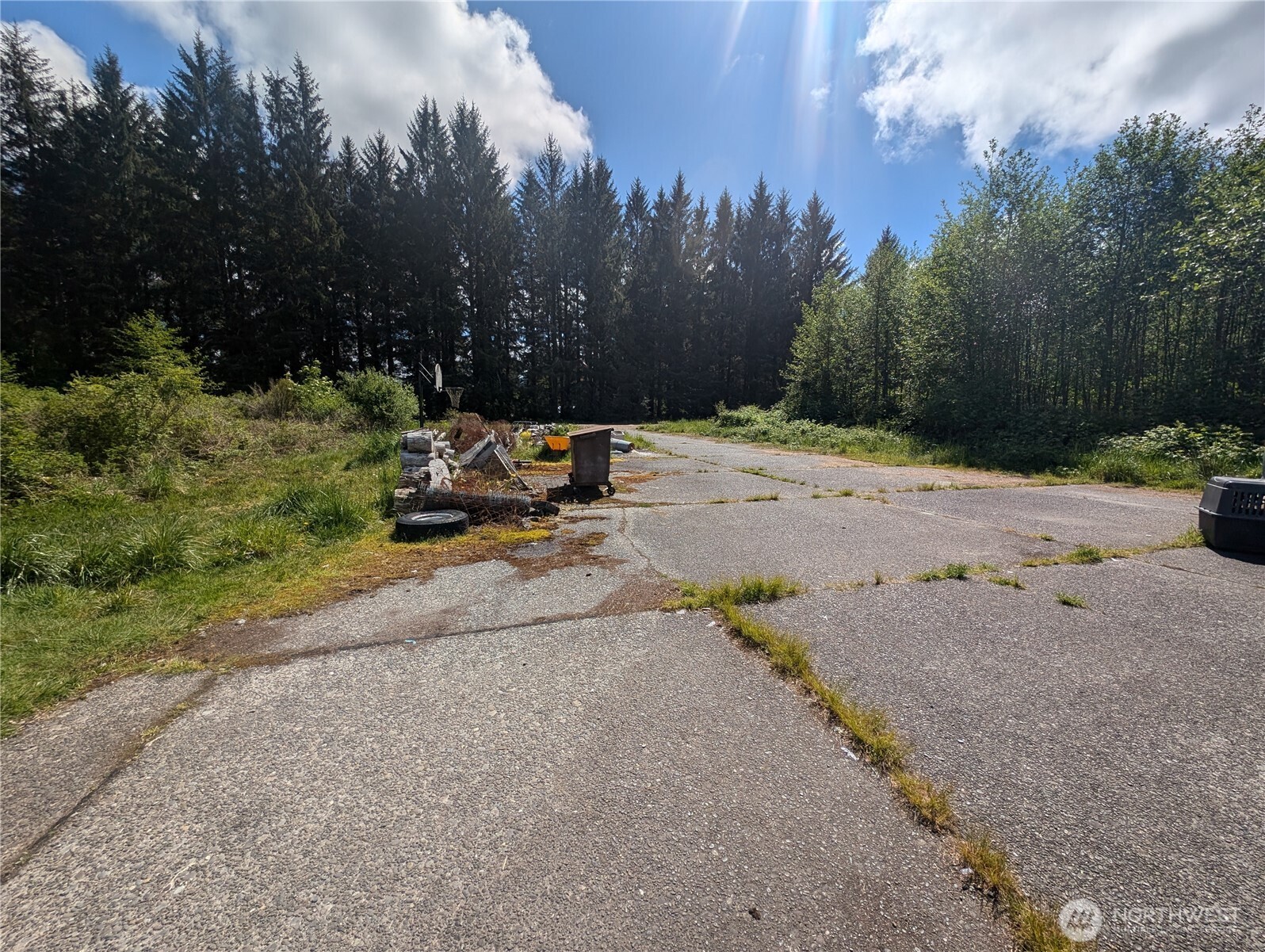 235 Delta Wing Drive Forks, WA 98331 - Photo 3 of 40 a view of a street with a bench in the background