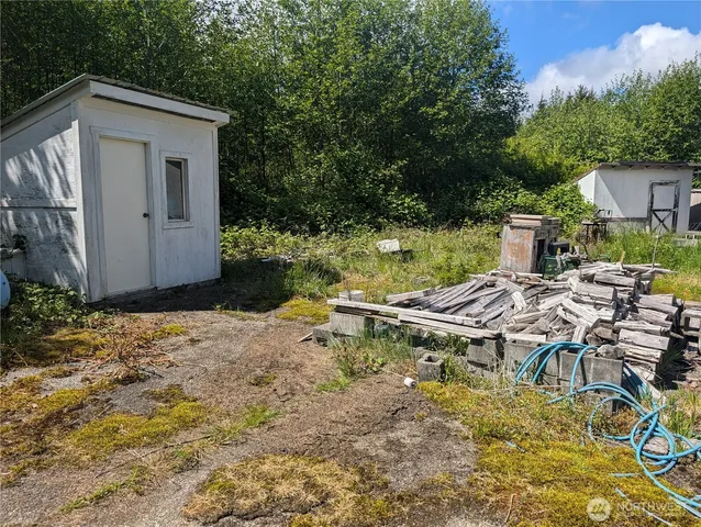a backyard of a house with yard and outdoor seating
