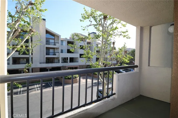 a view of a balcony with an outdoor space