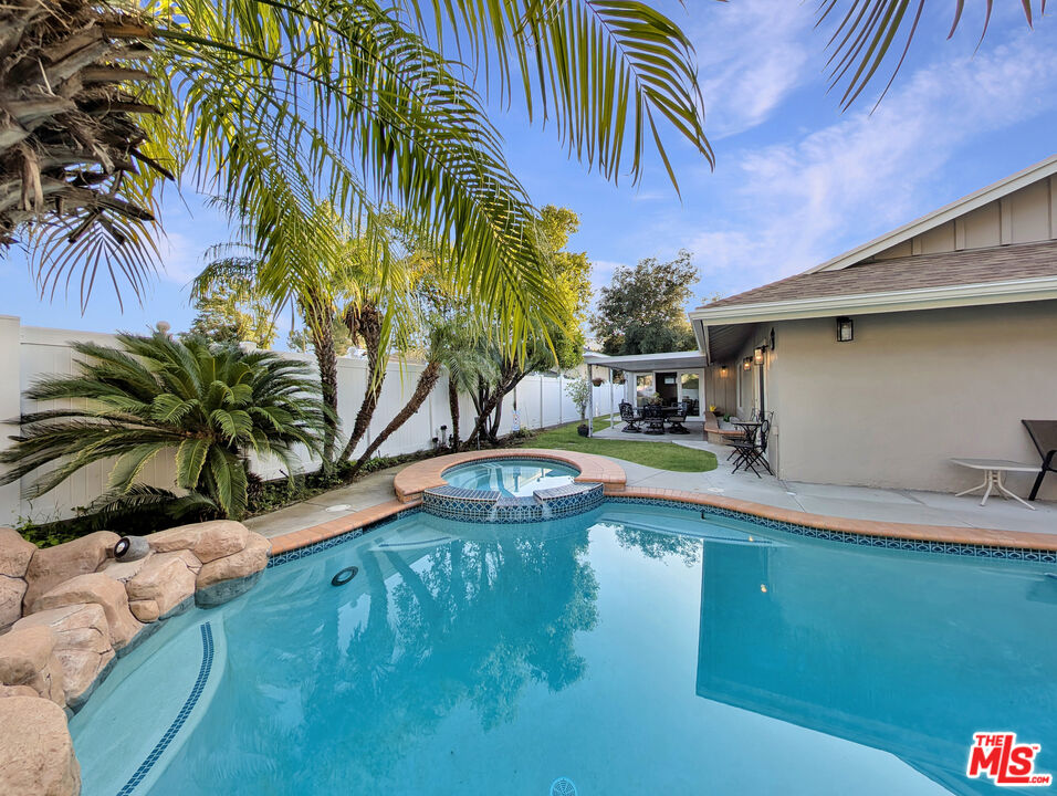 3308 Sparr Boulevard Glendale, CA 91208 - Photo 1 of 1 a swimming pool with a lawn chairs and potted plants