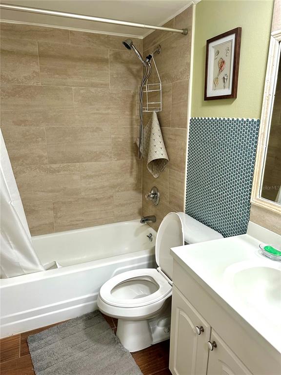 12760 Indian Rocks Road, Unit 903 Largo, FL 33774 - Photo 14 of 19 a bathroom with a toilet a sink and bathtub