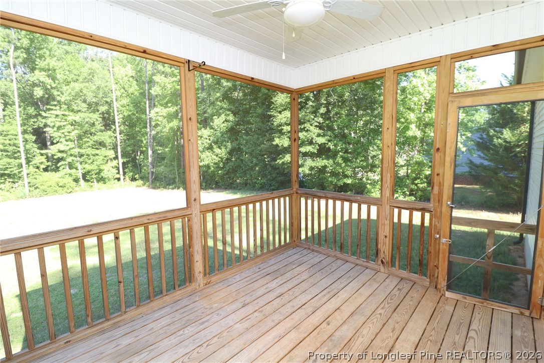 8424 Rhodes Road Apex, NC 27539 - Photo 29 of 31 a view of a wooden deck with a yard