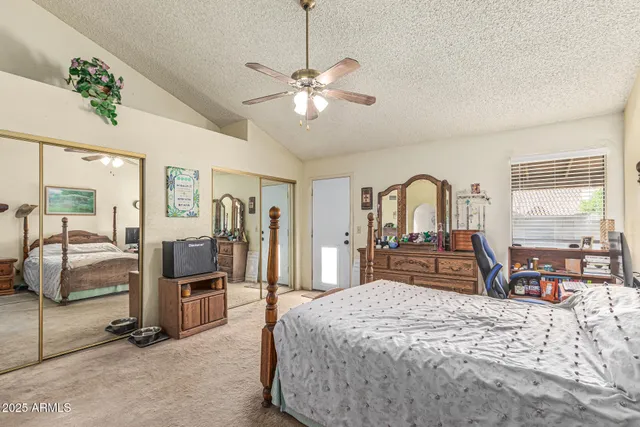 a bedroom with a bed and window