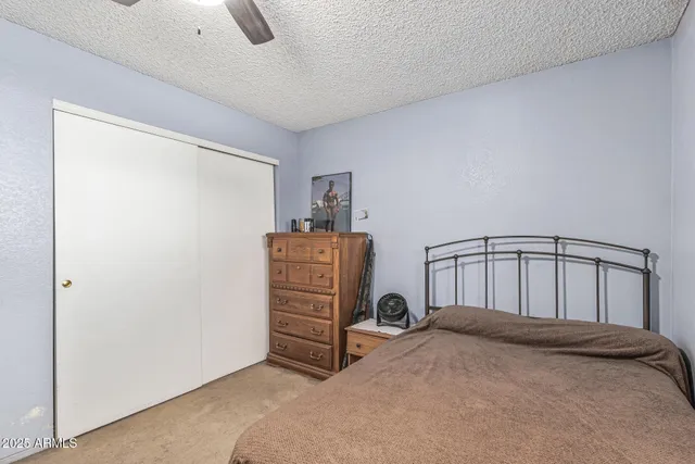a bedroom with furniture and a chandelier