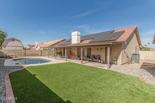 a front view of house with yard barbeque oven and outdoor seating