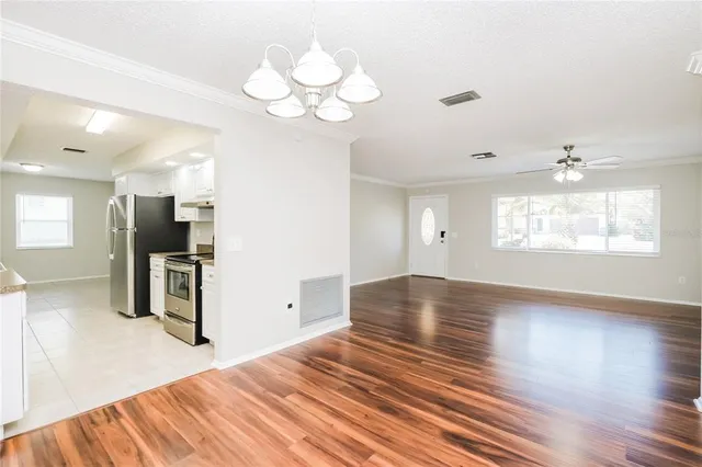 a view of an empty room with a window