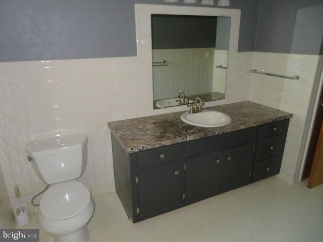 1240 Hoff Road Hanover, PA 17331 - Photo 18 of 51 a bathroom with a granite countertop toilet sink and mirror