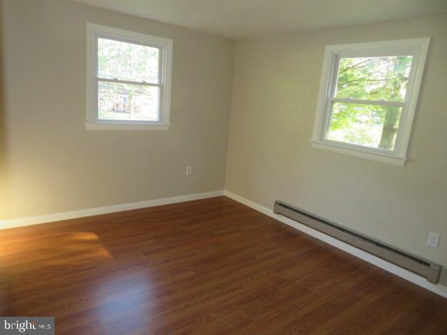 1240 Hoff Road Hanover, PA 17331 - Photo 22 of 51 an empty room with wooden floor and windows
